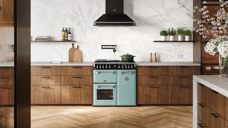 A luxury kitchen with a freestanding oven filled with cooked dishes A luxury kitchen with a freestanding oven filled with cooked dishes