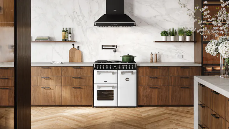 A luxury kitchen with a freestanding oven filled with cooked dishes A luxury kitchen with a freestanding oven filled with cooked dishes