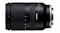 Side view of the black camera lens with the Tamron logo Side view of the black camera lens with the Tamron logo