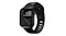 Black Nomad sport watch band for Apple Watch with a perforated design, displaying time, date, and weather on a dark patterned watch face Black Nomad sport watch band for Apple Watch with a perforated design, displaying time, date, and weather on a dark patterned watch face