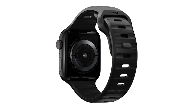 Rear view of a black Nomad smartwatch with a perforated sport band, showing the heart-rate sensor and case back Rear view of a black Nomad smartwatch with a perforated sport band, showing the heart-rate sensor and case back