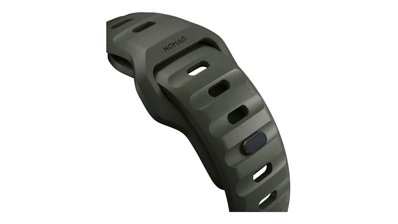 Close-up of an ash green perforated sport band with a metal pin closure and NOMAD branding Close-up of an ash green perforated sport band with a metal pin closure and NOMAD branding