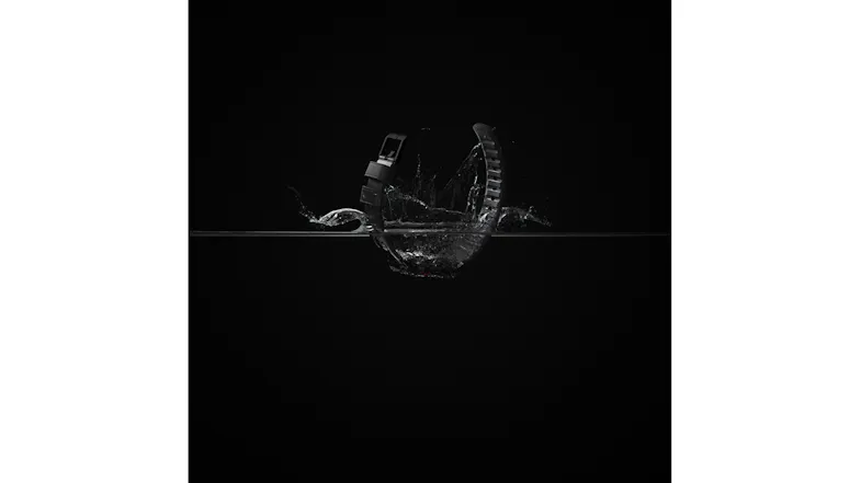 A smartwatch band splashing into water demonstrating high water resistance and durability A smartwatch band splashing into water demonstrating high water resistance and durability