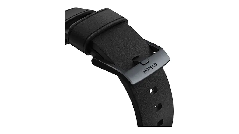 A detailed close-up of a black watch strap with a brushed silver metal buckle A detailed close-up of a black watch strap with a brushed silver metal buckle