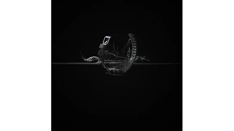 A smartwatch band splashing into water demonstrating high water resistance and durability A smartwatch band splashing into water demonstrating high water resistance and durability