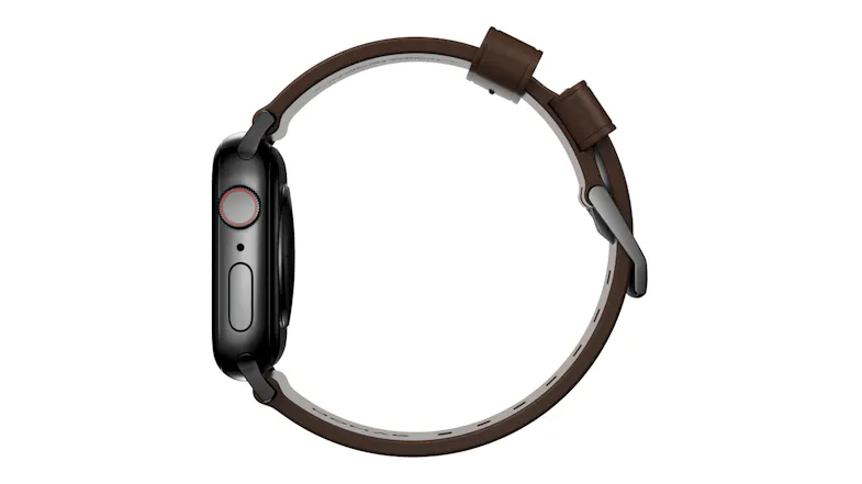 A side view profile of a smartwatch with a leather strap, side button dial, and a buckle A side view profile of a smartwatch with a leather strap, side button dial, and a buckle
