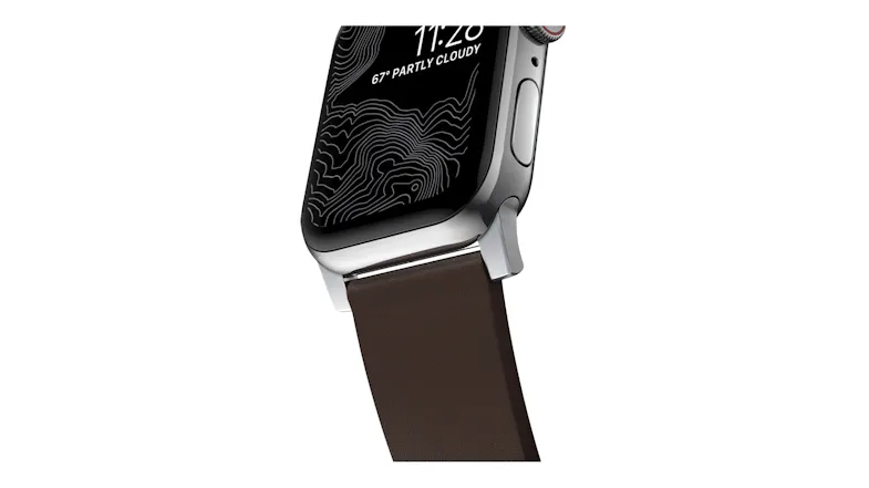Close-up of a silver smartwatch lug and strap, displaying a topographic watch face with time of 11:28 and weather info Close-up of a silver smartwatch lug and strap, displaying a topographic watch face with time of 11:28 and weather info