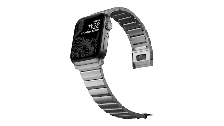 Titanium Apple Watch with a silver metal link band, shown with an open magnetic clasp and adjustable closure Titanium Apple Watch with a silver metal link band, shown with an open magnetic clasp and adjustable closure