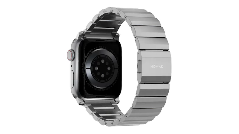 Rear view of a titanium Apple Watch with a silver metal link band, showing the heart rate sensor and clasp Rear view of a titanium Apple Watch with a silver metal link band, showing the heart rate sensor and clasp