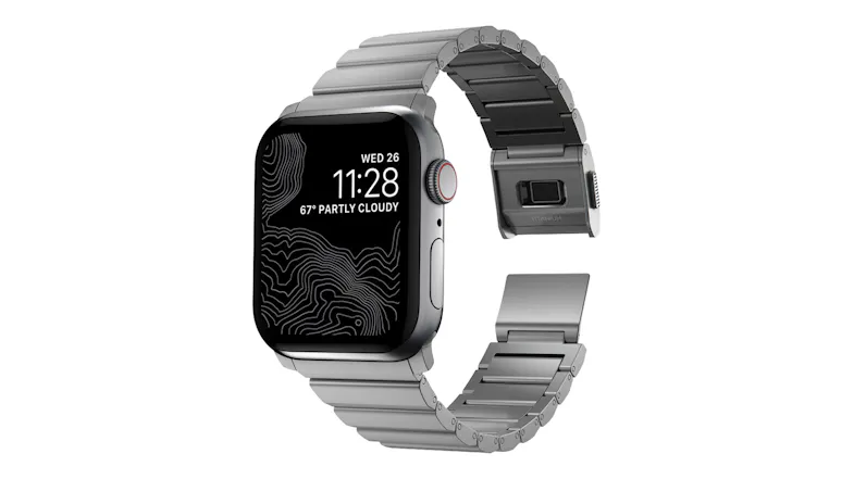 Titanium Apple Watch with a silver metal link band, shown with a partially open magnetic clasp Titanium Apple Watch with a silver metal link band, shown with a partially open magnetic clasp