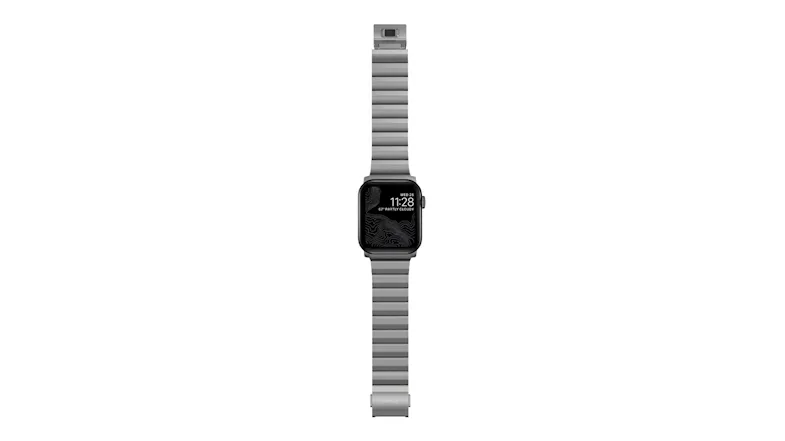 Front view of a Nomad titanium Apple Watch with a silver metal link band and matching clasp Front view of a Nomad titanium Apple Watch with a silver metal link band and matching clasp