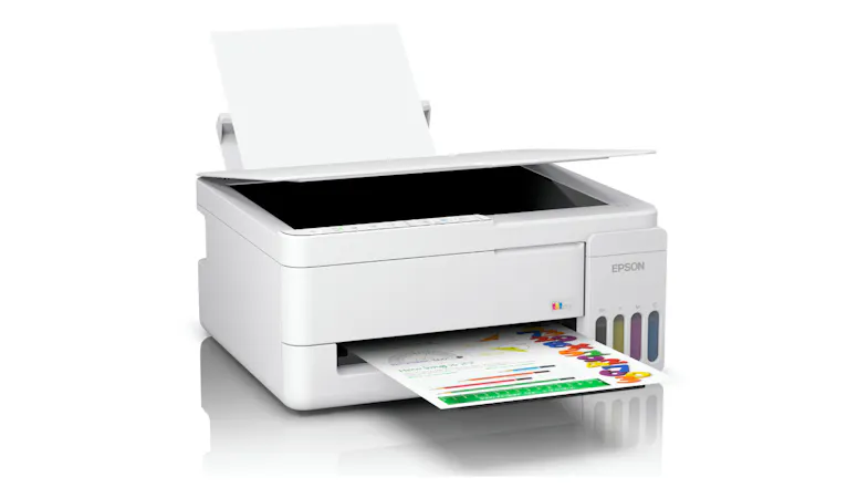 White Epson EcoTank printer printing a colour page, with the scanner lid open and the rear paper feeder loaded White Epson EcoTank printer printing a colour page, with the scanner lid open and the rear paper feeder loaded