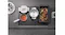 Overhead view of a black Miele induction cooktop featuring multiple steaming pots and a rectangular roasting pan Overhead view of a black Miele induction cooktop featuring multiple steaming pots and a rectangular roasting pan