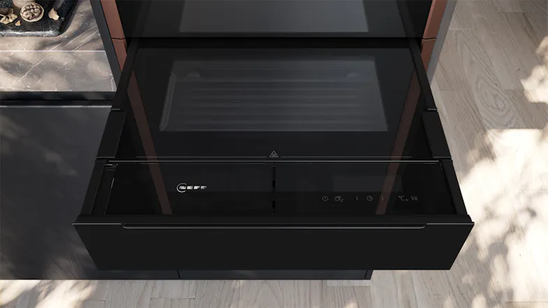 Open black Neff N 90 Series 14cm Built-In Steam Drawer with a glass lid and touch controls, viewed from above Open black Neff N 90 Series 14cm Built-In Steam Drawer with a glass lid and touch controls, viewed from above