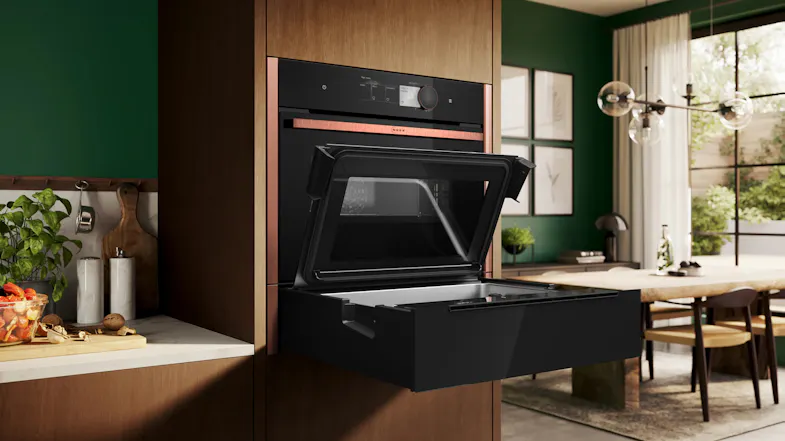 Built-in Neff N 90 Series 14cm Built-In Steam Drawer with glass lid raised, revealing the interior compartment Built-in Neff N 90 Series 14cm Built-In Steam Drawer with glass lid raised, revealing the interior compartment