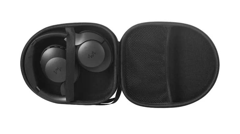 Black active noise cancelling headphones stored inside an open protective carrying case Black active noise cancelling headphones stored inside an open protective carrying case