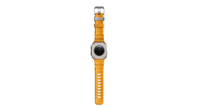Full vertical back view of Apple Watch Ultra laid flat, showing heart rate optical sensors and black rubber watch band Full vertical back view of Apple Watch Ultra laid flat, showing heart rate optical sensors and black rubber watch band