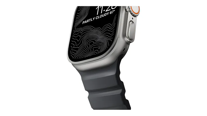 Close-up angle of Apple Watch Ultra titanium case lug attached to a ribbed rubber strap with topographic display Close-up angle of Apple Watch Ultra titanium case lug attached to a ribbed rubber strap with topographic display