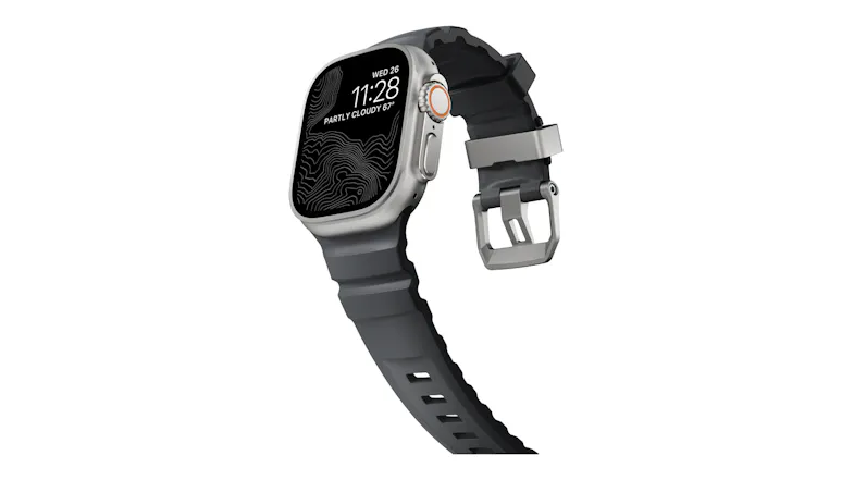 Angled view of Apple Watch Ultra showing topographic map display, rubber strap curving down, and titanium buckle Angled view of Apple Watch Ultra showing topographic map display, rubber strap curving down, and titanium buckle