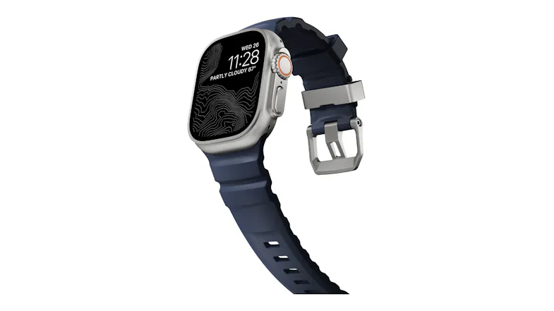 Angled view of Apple Watch Ultra showing topographic map display, rubber strap curving down, and titanium buckle Angled view of Apple Watch Ultra showing topographic map display, rubber strap curving down, and titanium buckle
