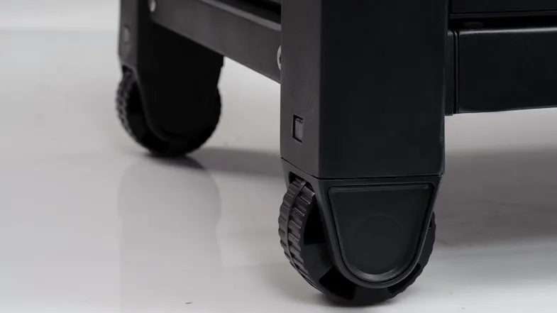 Close-up view of storage base featuring dual caster wheels Close-up view of storage base featuring dual caster wheels