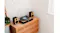 Close-up view featuring the turntable system on a wooden credenza Close-up view featuring the turntable system on a wooden credenza