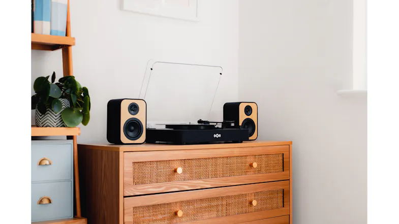 Modern room showing the audio system set up on a low dresser Modern room showing the audio system set up on a low dresser