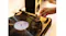 Lifestyle shot featuring hands interacting with the turntable Lifestyle shot featuring hands interacting with the turntable