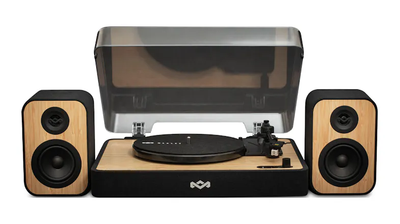 Front view showing the turntable with dust cover and speakers Front view showing the turntable with dust cover and speakers