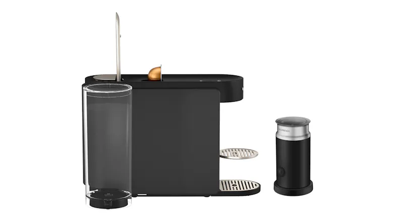 Side view of the coffee maker with capsule and frother showcasing brewing setup Side view of the coffee maker with capsule and frother showcasing brewing setup