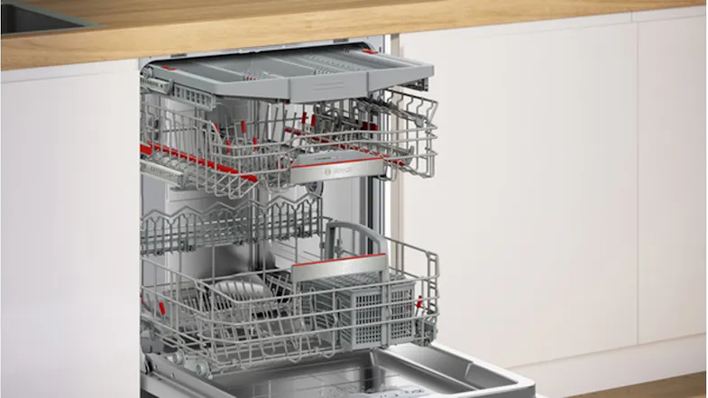 An open Bosch series 8 dishwasher showcasing wire racks An open Bosch series 8 dishwasher showcasing wire racks