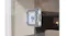 Close-up view showing a base station emitting spray mist while charging Close-up view showing a base station emitting spray mist while charging
