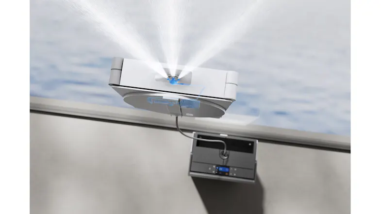 Action shot highlighting dual water spray jets from a window cleaning robot Action shot highlighting dual water spray jets from a window cleaning robot