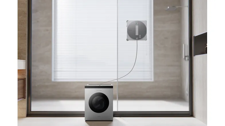 Indoor view highlighting a window cleaning robot operating on glass doors Indoor view highlighting a window cleaning robot operating on glass doors
