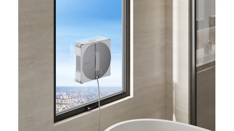 Bright living room view featuring a window robot cleaning large glass panels Bright living room view featuring a window robot cleaning large glass panels