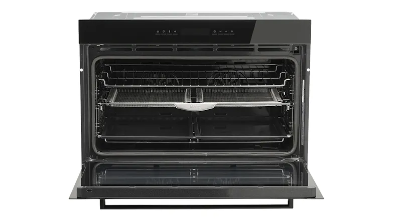 Whirlpool built-in oven with the door open, revealing the spacious interior, multiple shelf positions, and cooking racks Whirlpool built-in oven with the door open, revealing the spacious interior, multiple shelf positions, and cooking racks