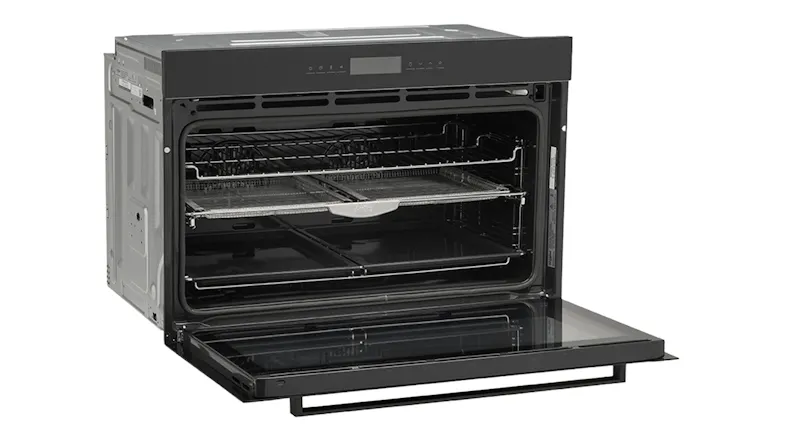 Whirlpool built-in oven with the door lowered, displaying the oven cavity and rack layout for versatile cooking Whirlpool built-in oven with the door lowered, displaying the oven cavity and rack layout for versatile cooking