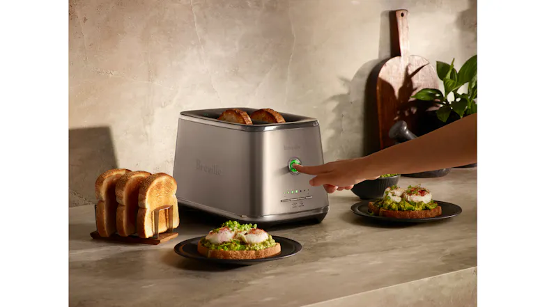 A marbled counter featuring Breville toaster with plates A marbled counter featuring Breville toaster with plates