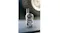 Camouflage Uniden UH45 Max UHF handheld radio standing upright on a flat surface with a blurred vehicle tyre in the background Camouflage Uniden UH45 Max UHF handheld radio standing upright on a flat surface with a blurred vehicle tyre in the background