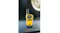 Yellow Uniden handheld radio standing on a flat surface with a blurred vehicle tyre in the background Yellow Uniden handheld radio standing on a flat surface with a blurred vehicle tyre in the background