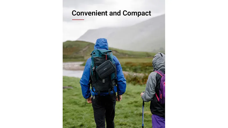 Rear view of a hiker outdoors with compact black shoulder case Rear view of a hiker outdoors with compact black shoulder case