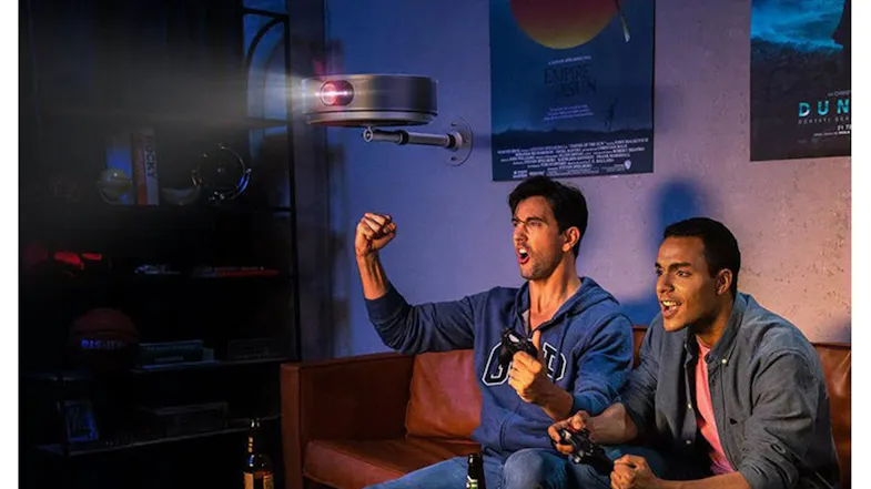 Two men watching a movie showcasing the Soundcore projector mounted overhead Two men watching a movie showcasing the Soundcore projector mounted overhead