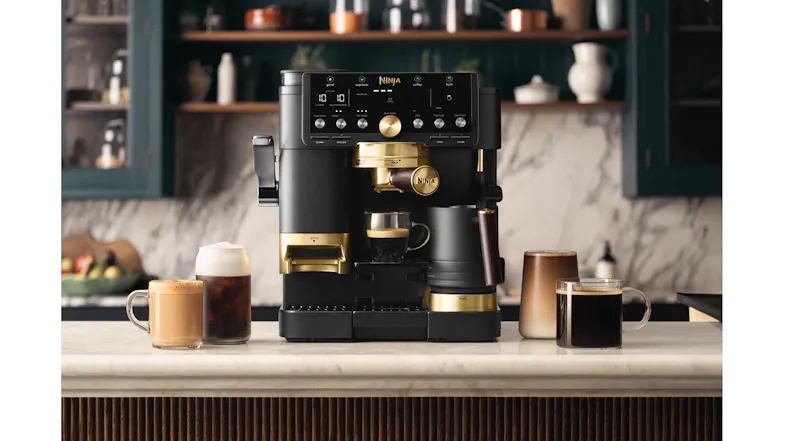 A view of multiple drinks and the Ninja Luxe Cafe Pro Machine displayed on an industrial-styled kitchen A view of multiple drinks and the Ninja Luxe Cafe Pro Machine displayed on an industrial-styled kitchen