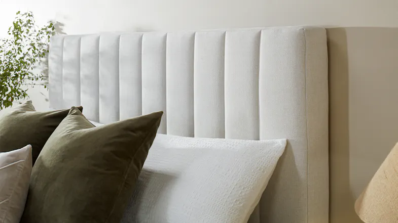 Close-up view of the Majestic Home Kyoto Super King Upholstered Headboard by Mlily in a modern bedroom Close-up view of the Majestic Home Kyoto Super King Upholstered Headboard by Mlily in a modern bedroom