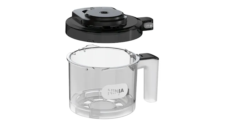 Transparent processing bowl with detached black lid positioned above Transparent processing bowl with detached black lid positioned above