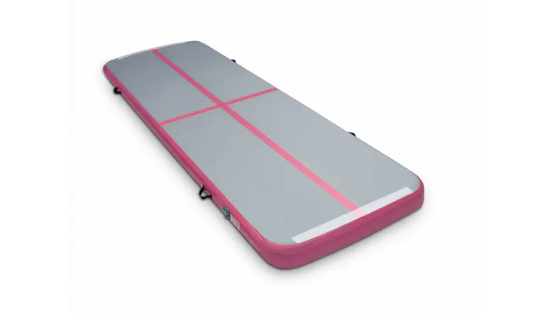 Angled view of a portable grey and pink inflatable training mat Angled view of a portable grey and pink inflatable training mat