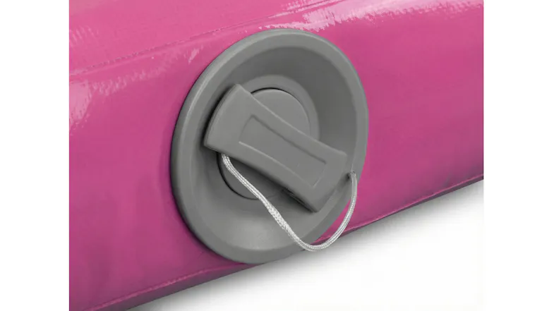 Close-up of the air track inflation valve on a pink PVC sidewall for easy inflation and sealing Close-up of the air track inflation valve on a pink PVC sidewall for easy inflation and sealing