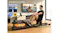 A man using a water rower at home while connected via Bluetooth to the Kinomap smart app displayed on a nearby smartphone A man using a water rower at home while connected via Bluetooth to the Kinomap smart app displayed on a nearby smartphone