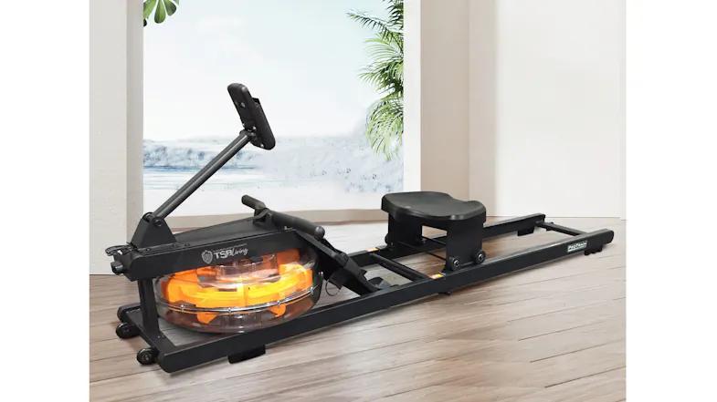 A water resistance rowing machine with an orange tank placed on a light wood floor in a brightly lit modern room A water resistance rowing machine with an orange tank placed on a light wood floor in a brightly lit modern room