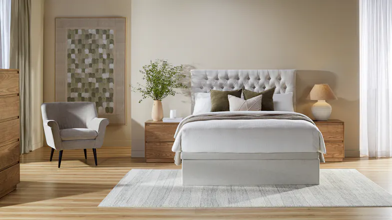 Wide bedroom view showcasing the Majestic Home Vienna Queen Upholstered Headboard attached to a bed Wide bedroom view showcasing the Majestic Home Vienna Queen Upholstered Headboard attached to a bed